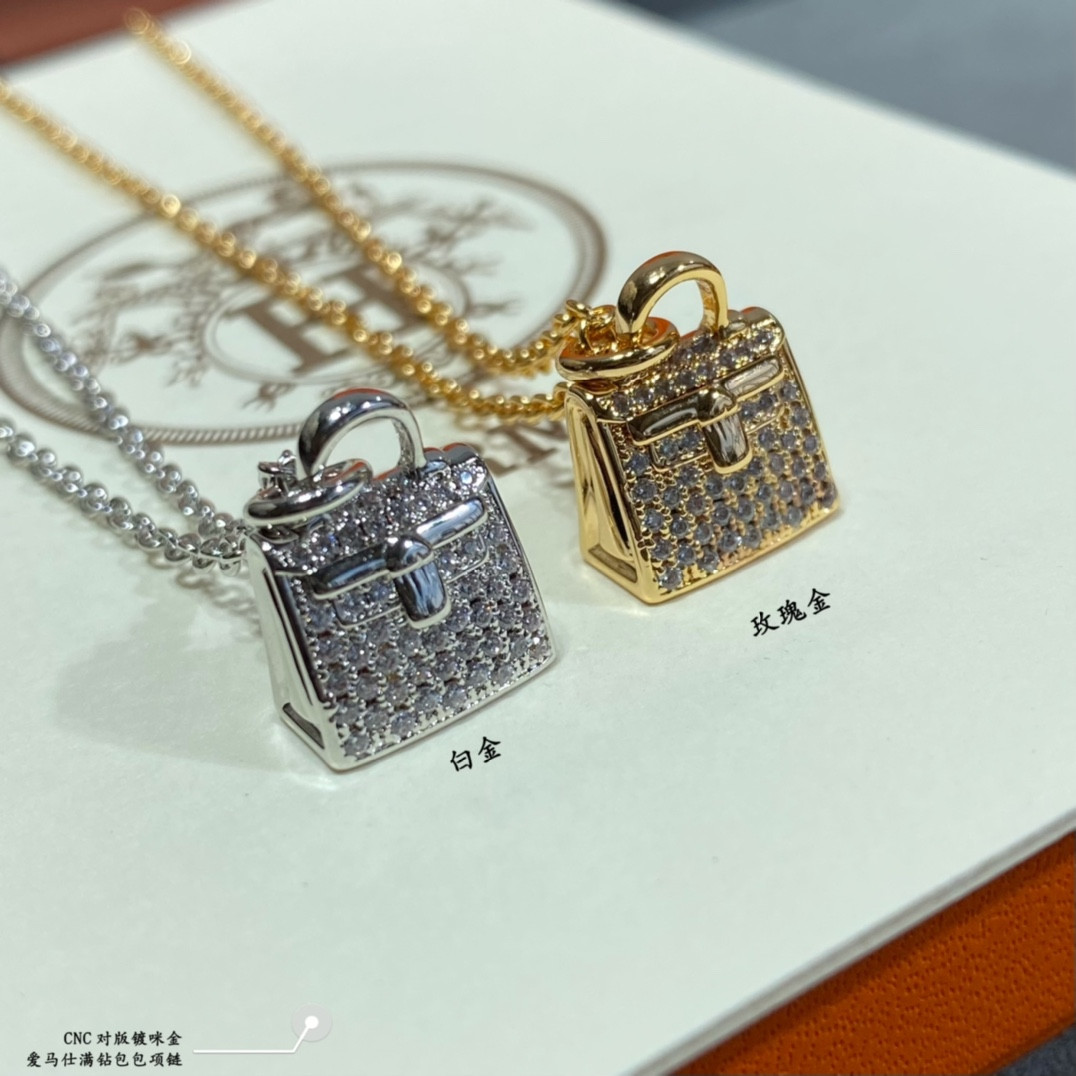 H**me5 fully di*m*nd-encrusted bag necklace