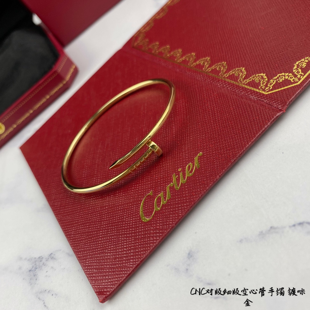 Ca*t*er thin hollow tube polished nail bracelet