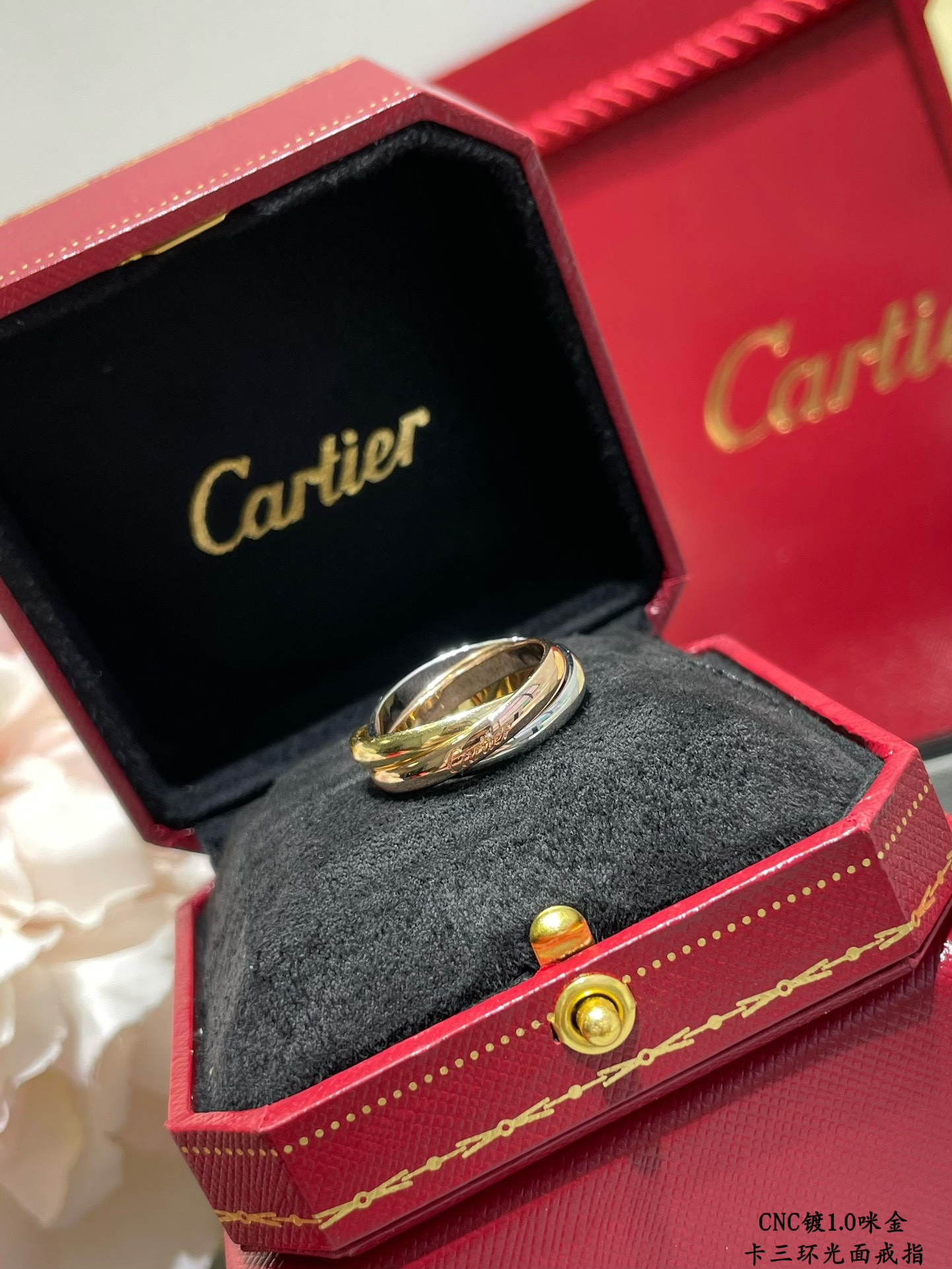 Ca*t*er three-ring polished ring