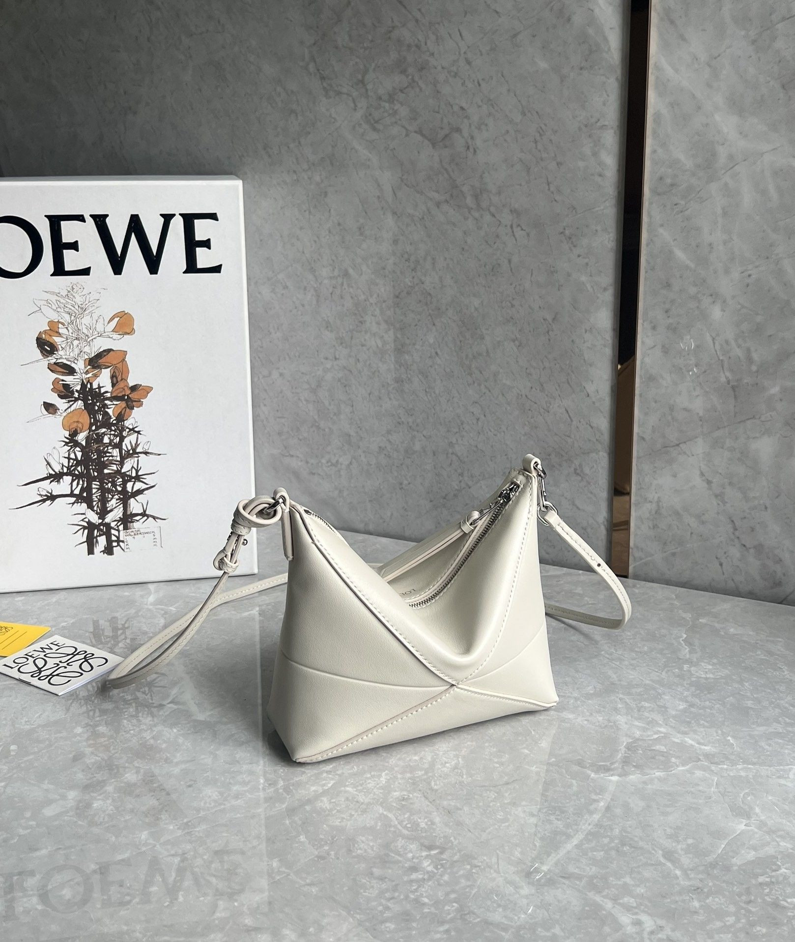 L0ew* puzzle fold pouch in shiny nappa calfskin 15.5x23x6.5cm