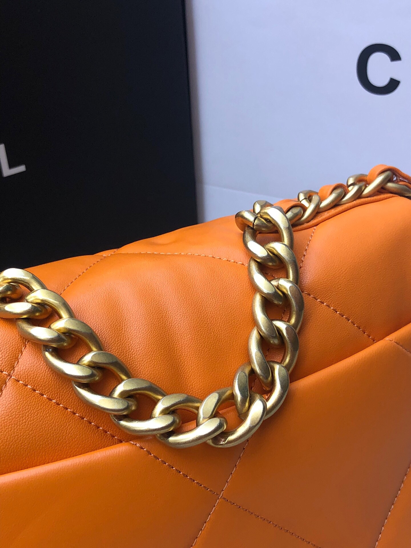 Ch*el 19 handbag shiny leather, gold-tone, silver-tone & ruthenium-finish metal orange 6.2 × 10.1 × 3.5 in