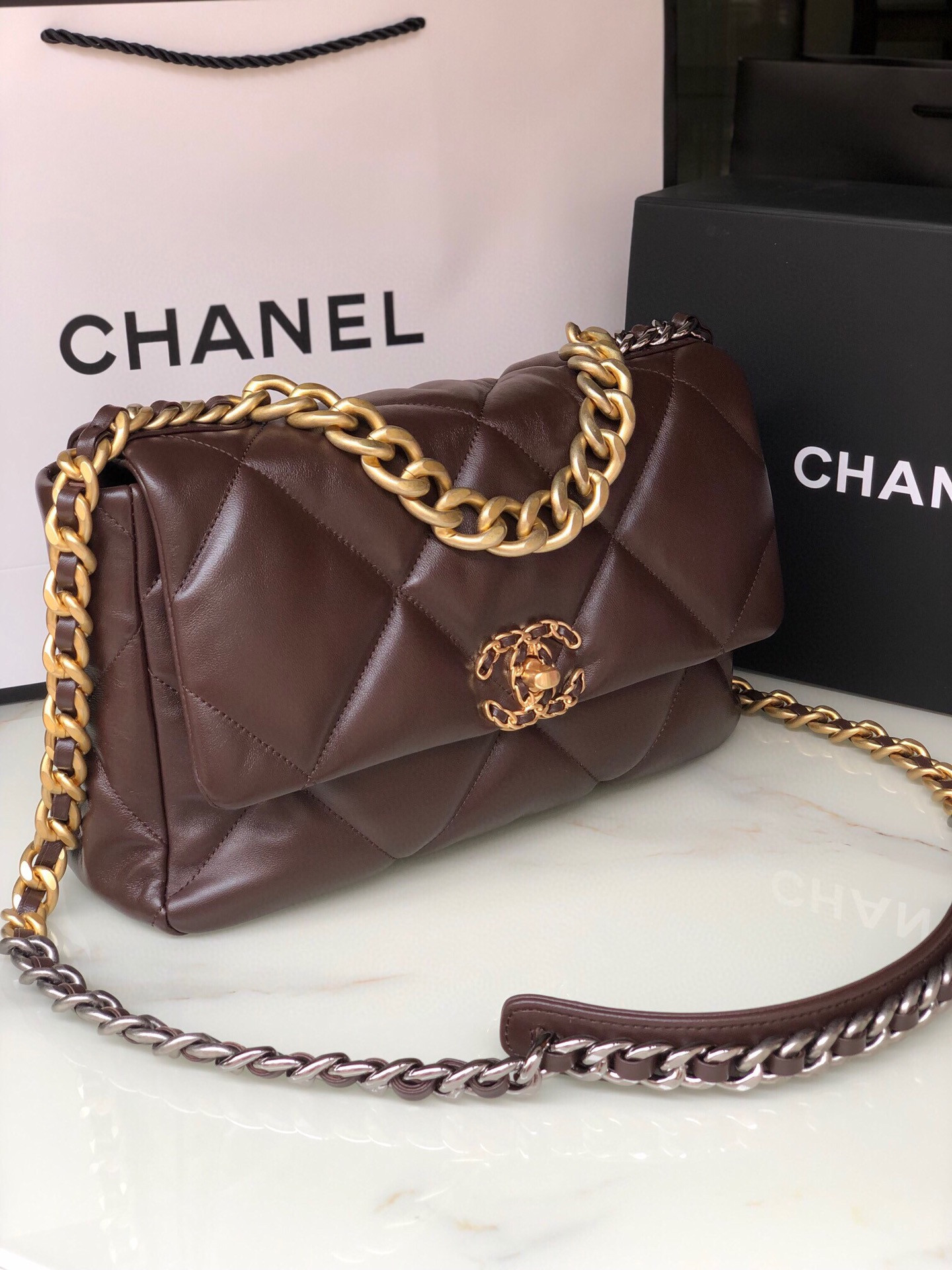 Ch*el 19 large handbag shiny leather, gold-tone, silver-tone & ruthenium-finish metal brown 7.8 × 11.7 × 3.9 in