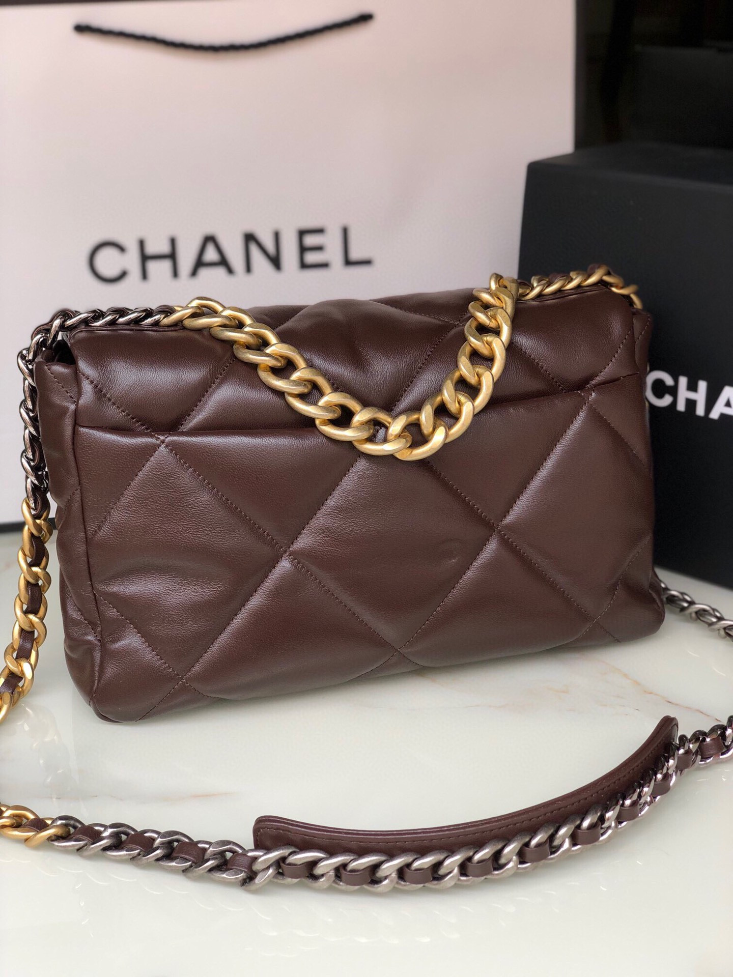 Ch*el 19 large handbag shiny leather, gold-tone, silver-tone & ruthenium-finish metal brown 7.8 × 11.7 × 3.9 in