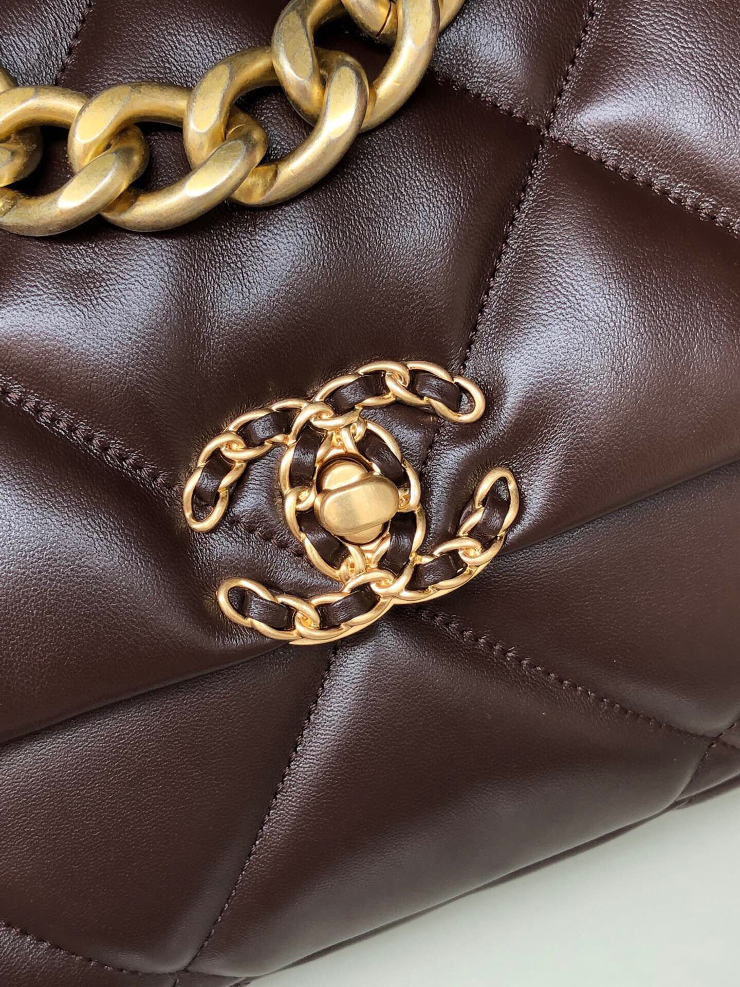 Ch*el 19 large handbag shiny leather, gold-tone, silver-tone & ruthenium-finish metal brown 7.8 × 11.7 × 3.9 in