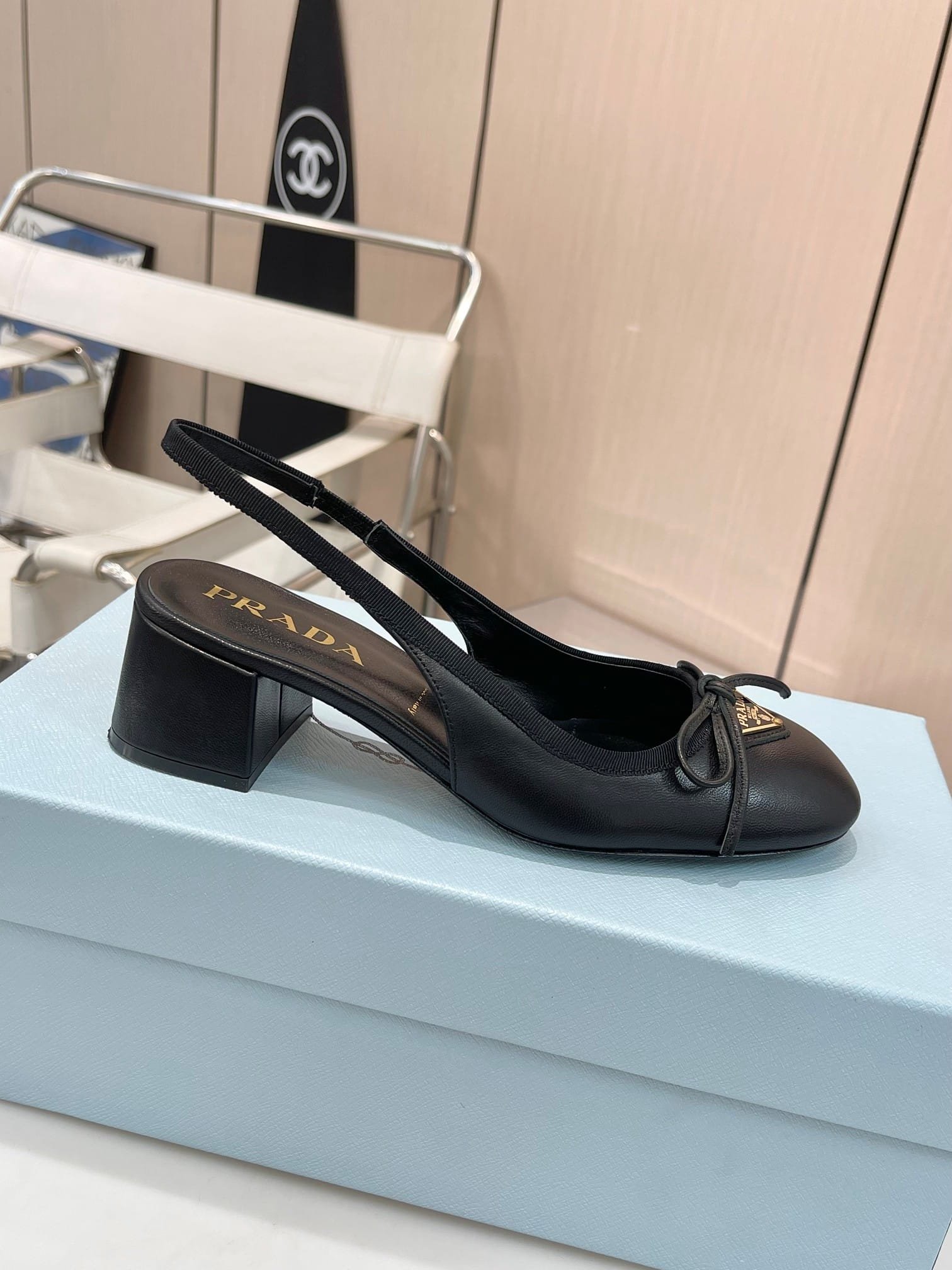 Pra*a Triangle Logo Bow Slingback Pump In Black