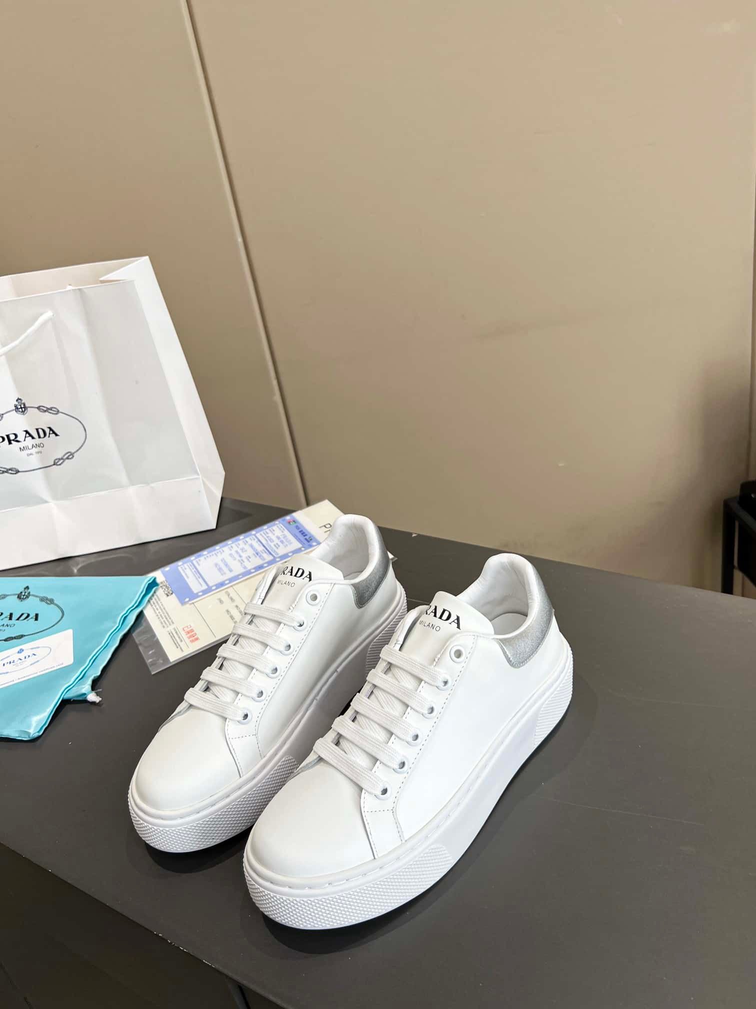 Pra*a Sneaker In White Leather With Silver Logo